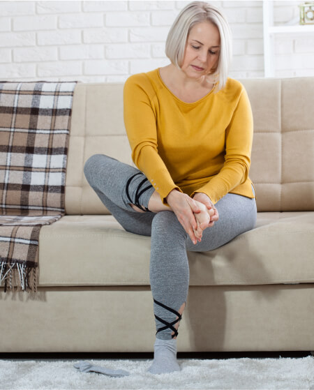 Senior checking feet